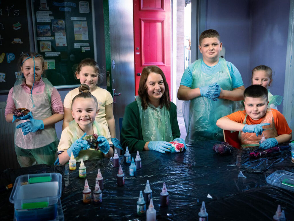 junior youth work 6 y peopl w blue gloves 4 3 crop
