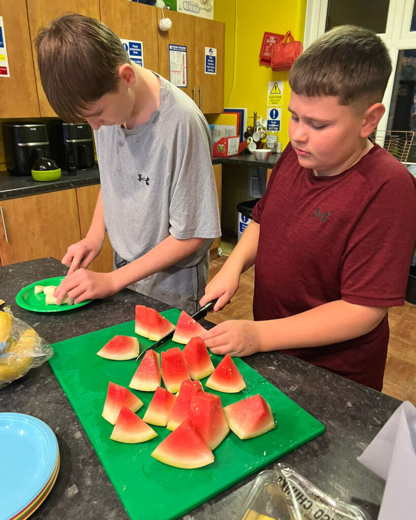 senior youth work cutting watermelon 4 5 crop